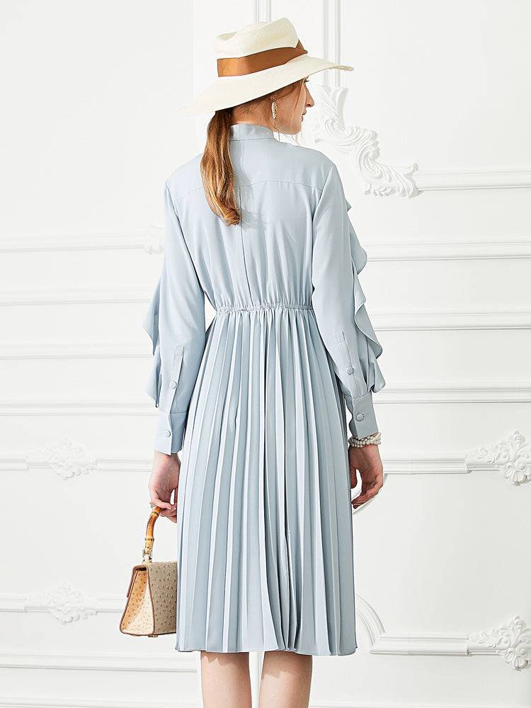 Elegant long sleeved dress with pleated skirt design