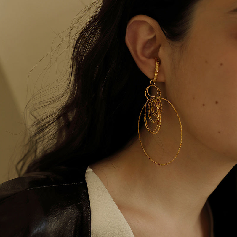 Feminine exaggerated cool earrings that can be looped