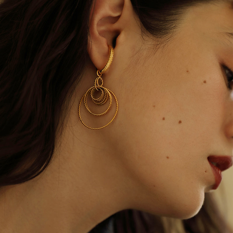 Feminine exaggerated cool earrings that can be looped