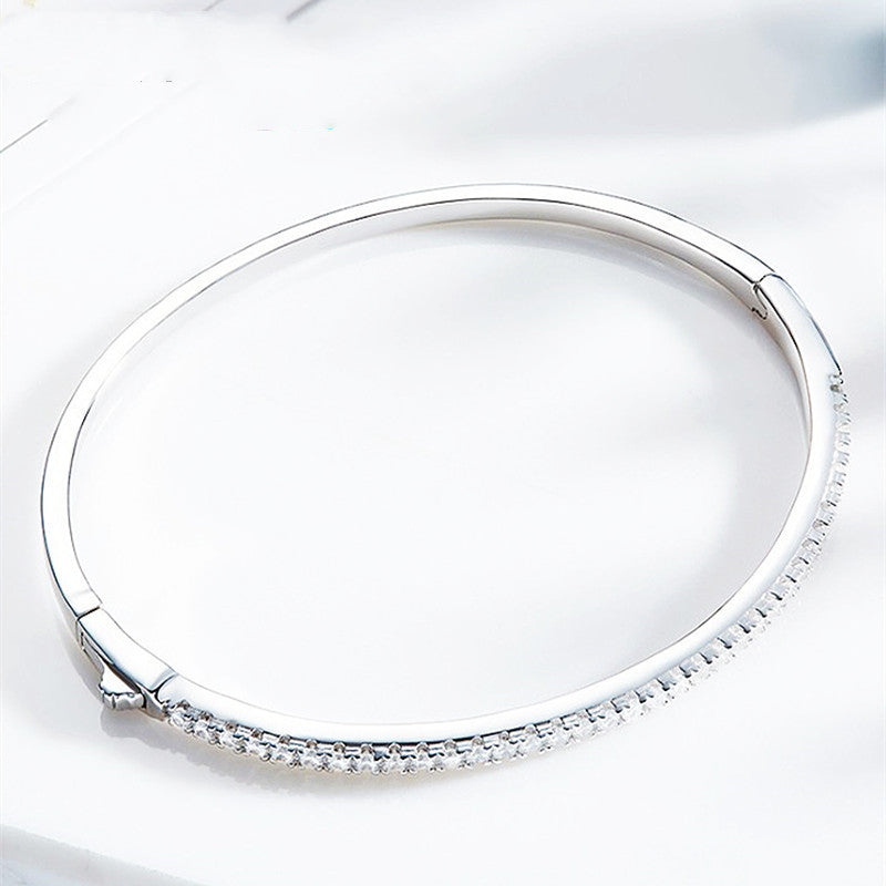 Minimally designed 18k white gold moissanite half bracelet for women