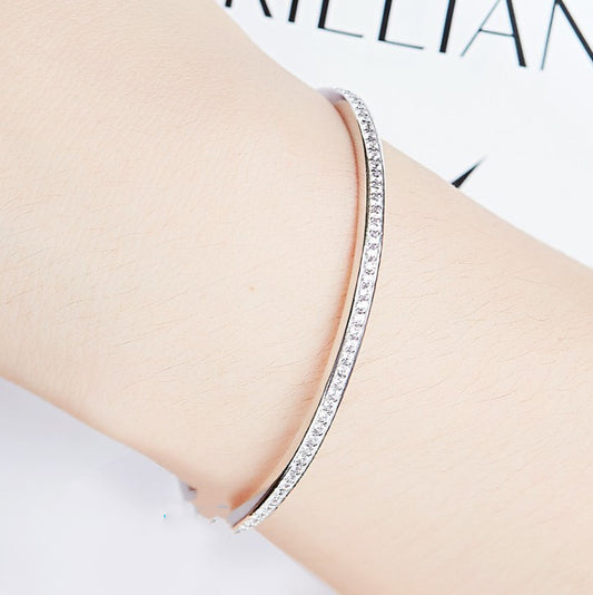 Minimally designed 18k white gold moissanite half bracelet for women