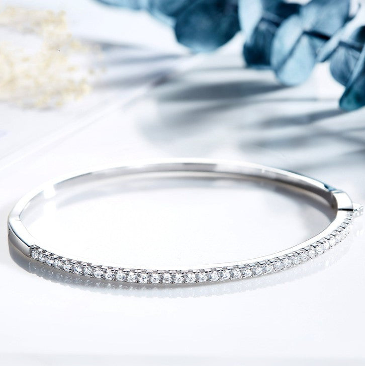 Minimally designed 18k white gold moissanite half bracelet for women